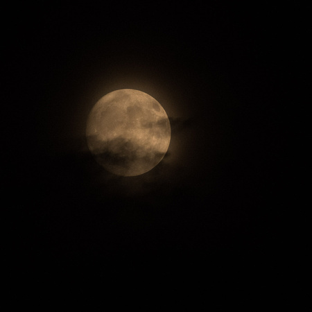 Full Moon through smoke and clouds